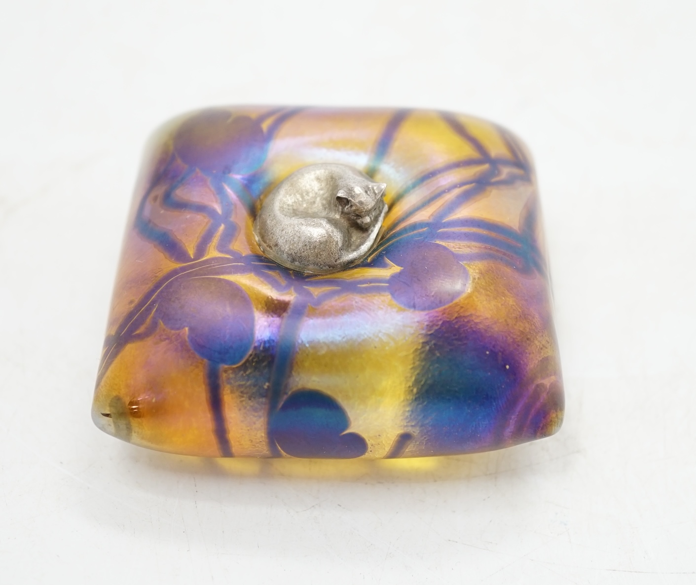 A John Ditchfield for Glasform paperweight modelled as a metal cat sitting on a cushion, 6.5cm square. Condition - fair